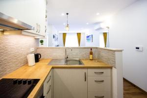 a kitchen with a sink and a counter top at Milara Apartments in Budva