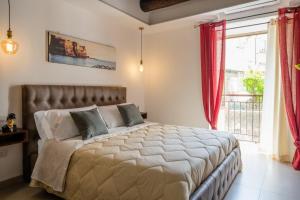 Ένα ή περισσότερα κρεβάτια σε δωμάτιο στο Residenza San Gregorio Armeno