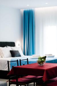 Postel nebo postele na pokoji v ubytování Athena Center Apartments