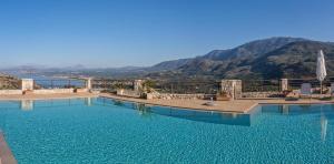 a large swimming pool with a view of the mountains at Villa Pomegrante in Exopoli +6 photos