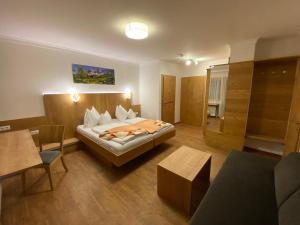 Letto o letti in una camera di Der Brückenhof Ramsau