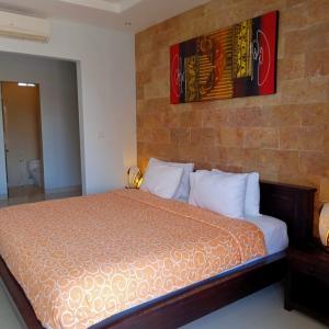 Ein Bett oder Betten in einem Zimmer der Unterkunft Nyoman Villa Sanur
