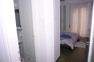 Postel nebo postele na pokoji v ubytování Captain's home loutraki
