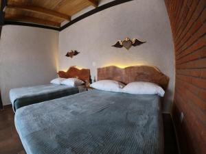 Postel nebo postele na pokoji v ubytování Hotel Viñedo los Arcángeles