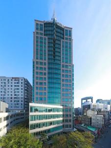 a large building with a lot of windows on top of it at Orakai Insadong Suites in Seoul