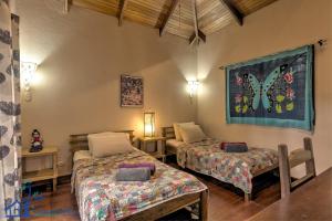 A bed or beds in a room at Casa Koda Beach Front