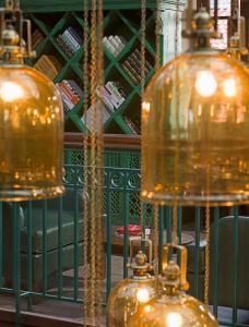 a group of three glass pendant lights in a store at The Tamara Kodai in Kodaikānāl