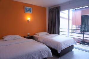 Ένα ή περισσότερα κρεβάτια σε δωμάτιο στο Dozy Lamoon House