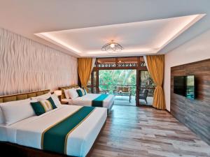 Postel nebo postele na pokoji v ubytování Loboc River Resort