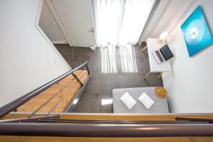 an overhead view of a staircase with a couch at JOY C Deluxe in Iraklitsa
