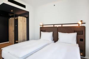 Posteľ alebo postele v izbe v ubytovaní H2 Hotel Budapest