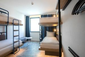 Posteľ alebo postele v izbe v ubytovaní H2 Hotel Budapest