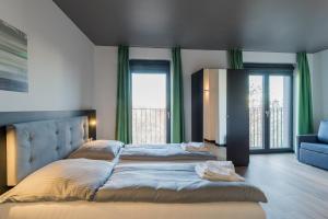 Postel nebo postele na pokoji v ubytování Nena Apartments - Kreuzberg 61
