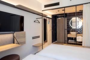 Posteľ alebo postele v izbe v ubytovaní H2 Hotel Budapest