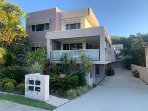 a house with a walkway in front of it at Riverview Apartment in Yamba
