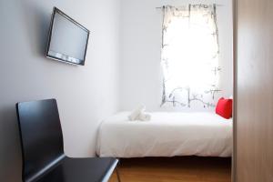 Posteľ alebo postele v izbe v ubytovaní Attic Bcn Central Terrace