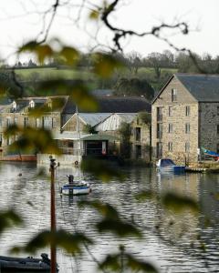 a body of water with boats in it at The Dog House, Penryn in Penryn