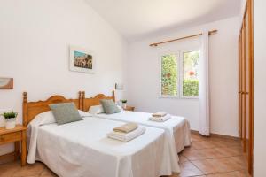 Postel nebo postele na pokoji v ubytování Villa Nurimar + 18 fotografií