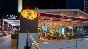 a restaurant with a sign that reads trauma coffee at Titanic Port Bakirkoy in Istanbul +33 photos