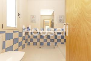 a bathroom with a blue and white tiled wall at Villa Tarifa in Tarifa +33 photos