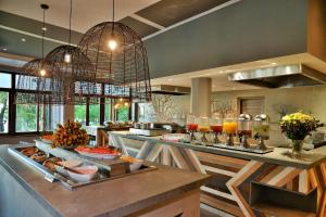 a kitchen with a counter with food on it at Cresta Mowana Safari Resort & Spa in Kasane