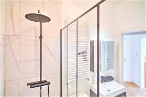 a bathroom with a shower and a sink at Penth A Apartment in Heart of Antwerp in Antwerp