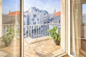 a balcony with a view of a city at Penth A Apartment in Heart of Antwerp in Antwerp +2 photos