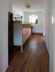 
a room with a wooden floor and wooden walls at Weingut Langmayer in Wösendorf
