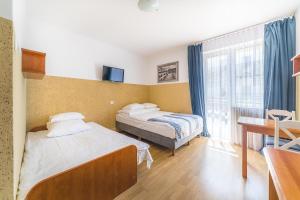 Posteľ alebo postele v izbe v ubytovaní Willa Zefirek