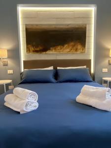 A bed or beds in a room at Beach apartments Isola d'Elba