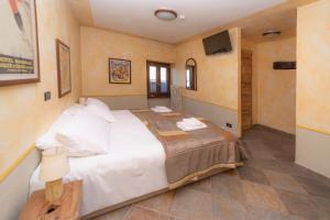 Postel nebo postele na pokoji v ubytování Hotel Gran Trun
