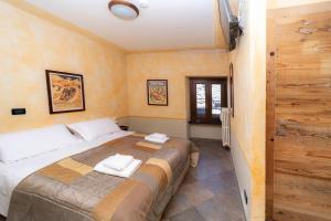 Postel nebo postele na pokoji v ubytování Hotel Gran Trun