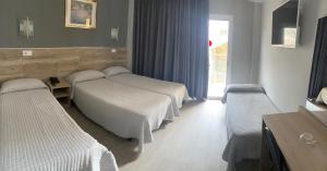 Ліжко або ліжка в номері Hotel Reymar Playa