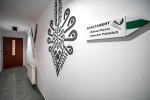 Certifikát, ocenenie alebo iný dokument vystavený v ubytovaní Apartamenty Tatrzańskie Doliny