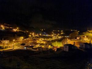 a city lit up at night with lights at Casa da Bisa - Santa Maria - Açores in Santa Bárbara