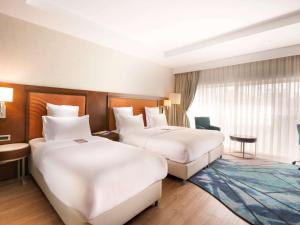 Postel nebo postele na pokoji v ubytování Mercure Istanbul Bakirkoy