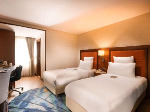 Postel nebo postele na pokoji v ubytování Mercure Istanbul Bakirkoy