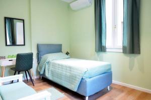 A bed or beds in a room at Meuble' 21 di Anna