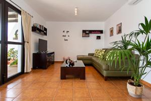 a living room with a couch and a coffee table at Apartment Fragata in Playa Honda