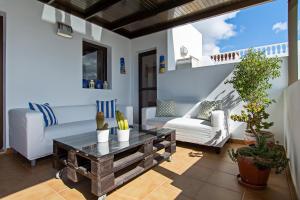a living room with a couch and a coffee table at Apartment Fragata in Playa Honda