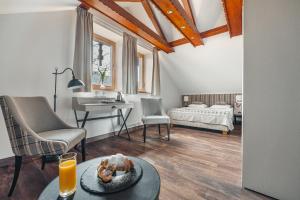 Postel nebo postele na pokoji v ubytování Hotel Batory