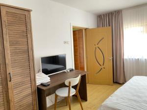 TV a/nebo společenská místnost v ubytování Casa Lac de Verde