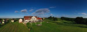 an aerial view of a large house on a green field at Hannersberg in Hannersdorf