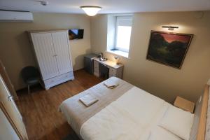 Postel nebo postele na pokoji v ubytování Hotel Jonapolis