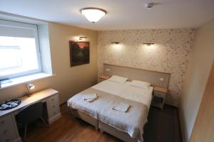 Postel nebo postele na pokoji v ubytování Hotel Jonapolis