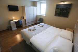Postel nebo postele na pokoji v ubytování Hotel Jonapolis