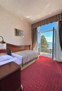 Posteľ alebo postele v izbe v ubytovaní Hotel Savoy
