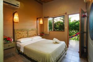 Ένα ή περισσότερα κρεβάτια σε δωμάτιο στο Hotel Kundalini