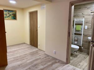 a bathroom with a toilet and a sink at Penzión Hradby in Bardejov