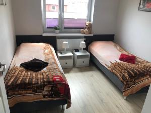 Łóżko lub łóżka w pokoju w obiekcie Klimatyzowany Apartament Londyn